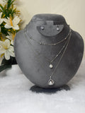 Multi-Layered Pearl Necklace Set with Oxidized Silver Floral Pendant and Earrings
