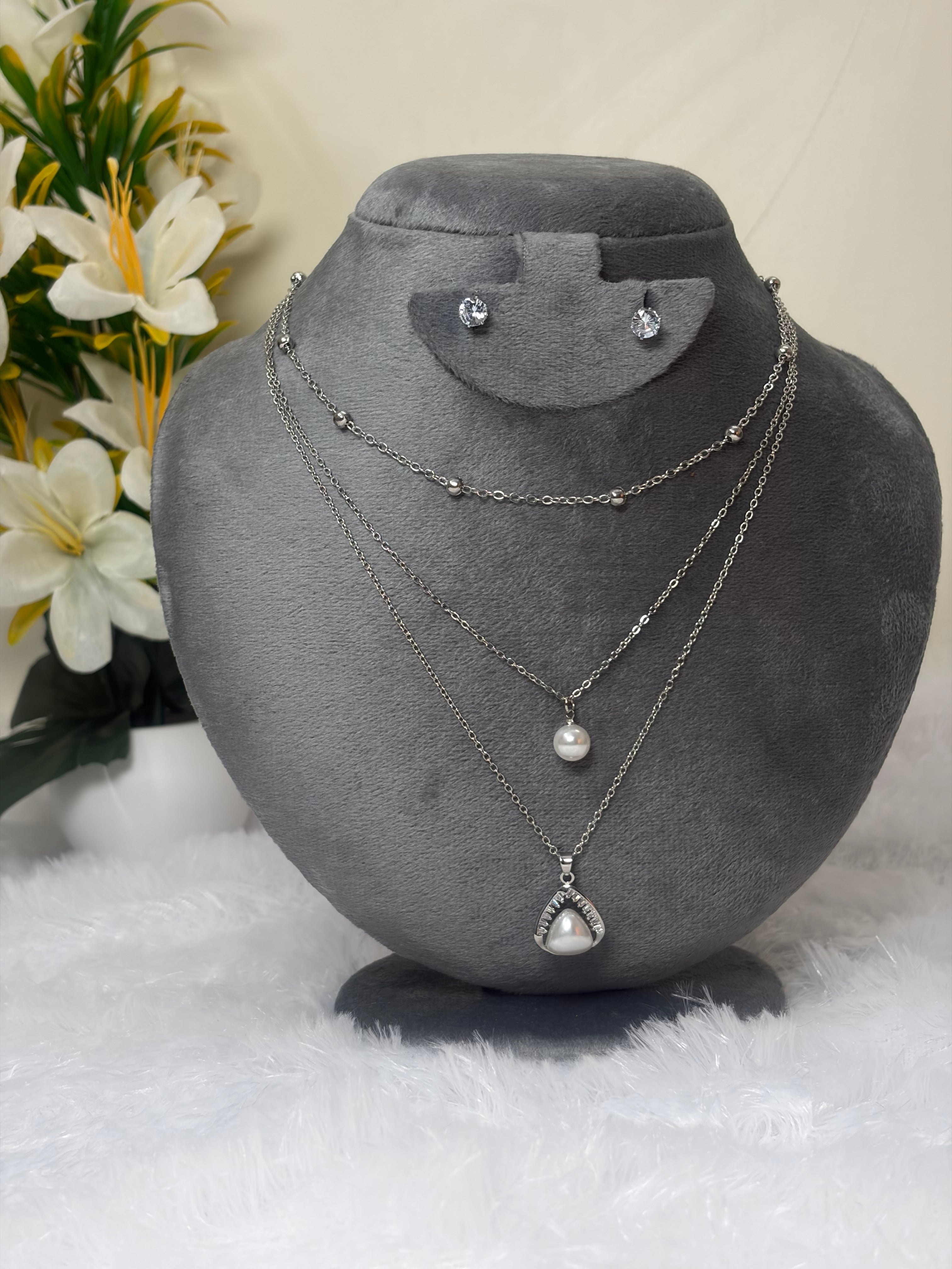 Multi-Layered Pearl Necklace Set with Oxidized Silver Floral Pendant and Earrings